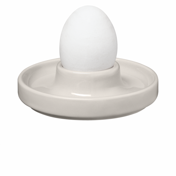 Ceramic egg cup with a white egg, perfect for serving soft-boiled eggs.
