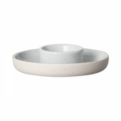Modern ceramic serving dish with a central bowl and outer platter for stylish dining.