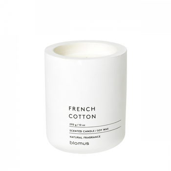 Scented soy wax candle in a sleek white container labeled "French Cotton."
