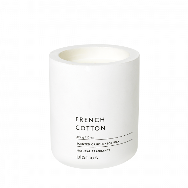 Scented soy wax candle in a sleek white container labeled "French Cotton."