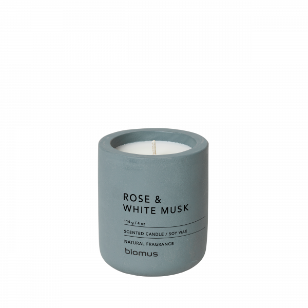 Rose and white musk scented candle in a gray concrete container by Blomus.
