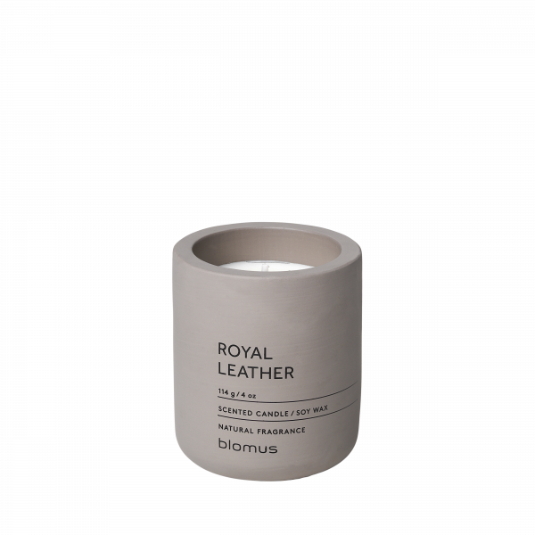 Scented candle in a minimalist beige container with "Royal Leather" label by Blomus.