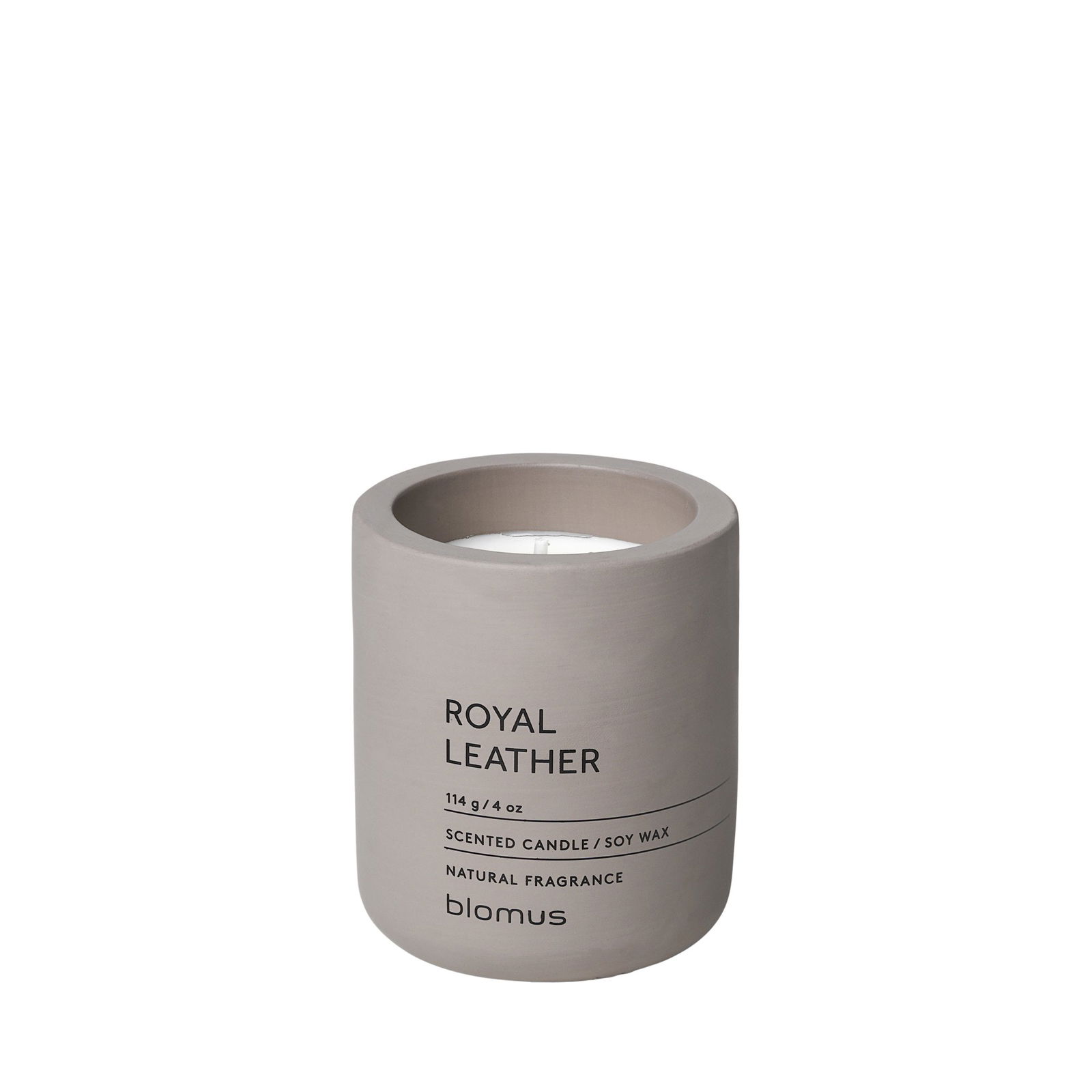 Scented candle in a minimalist beige container with "Royal Leather" label by Blomus.