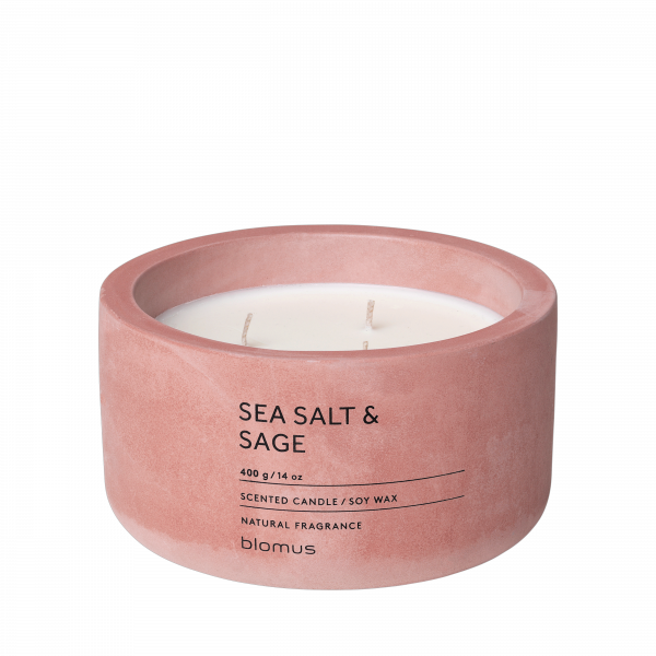 Pink sea salt and sage scented candle in a minimalist container for natural fragrance.