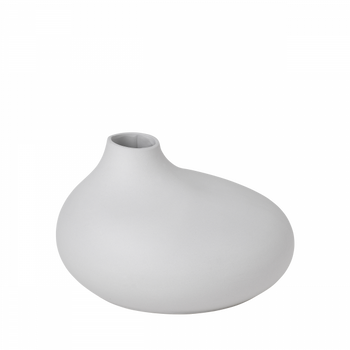 Minimalist white ceramic vase with a smooth, curvy design for modern home decor.