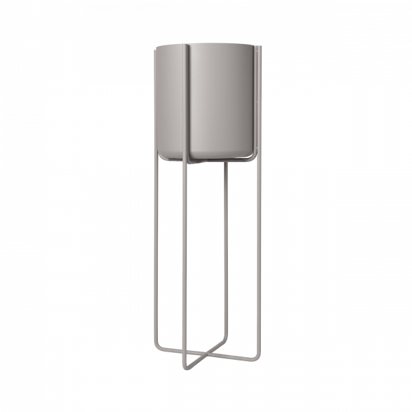 Modern minimalist planter with metal stand for indoor gardening.