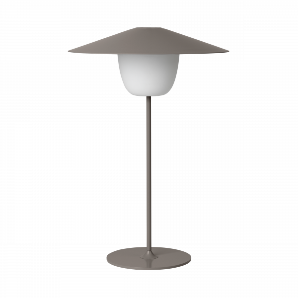 Moderne minimalistische Tischlampe mit einem breiten Schirm und runder Basis, perfekt für stilvolle Dekoration.