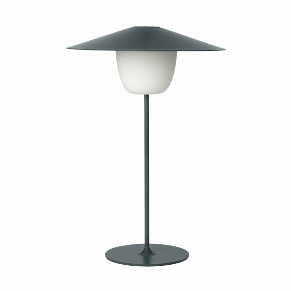 Stilvolle moderne Lampe mit einem runden Sockel und einem schlanken, minimalistischen Design.
