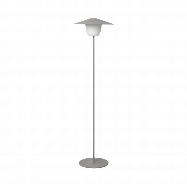 Modern floor lamp with a sleek design and a wide shade, perfect for enhancing living spaces.