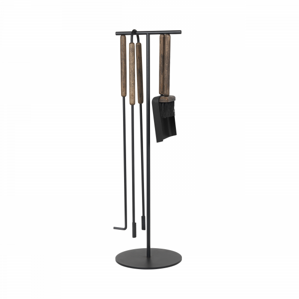 Stylish black tool holder with wooden cooking utensils for modern kitchen decor.