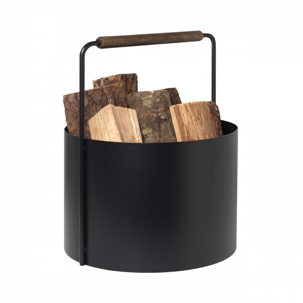 Black metal log basket with wooden handle, filled with firewood logs.