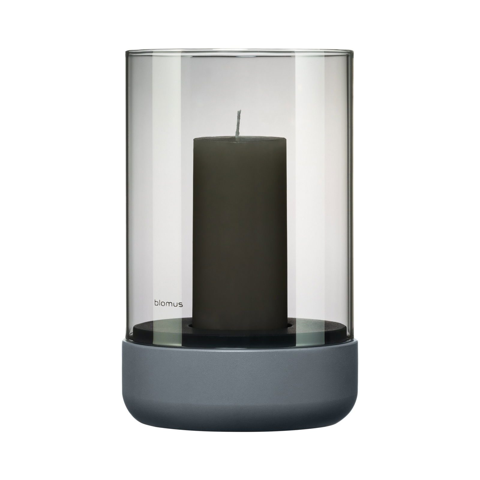 Elegant glass candle holder with a dark candle, designed by Blomus.