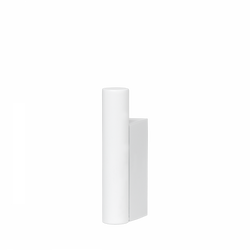 Modern minimalist white sculpture against a black background.