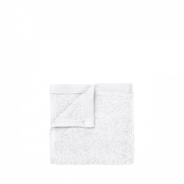 Soft white towel on a black background, perfect for home or spa use.