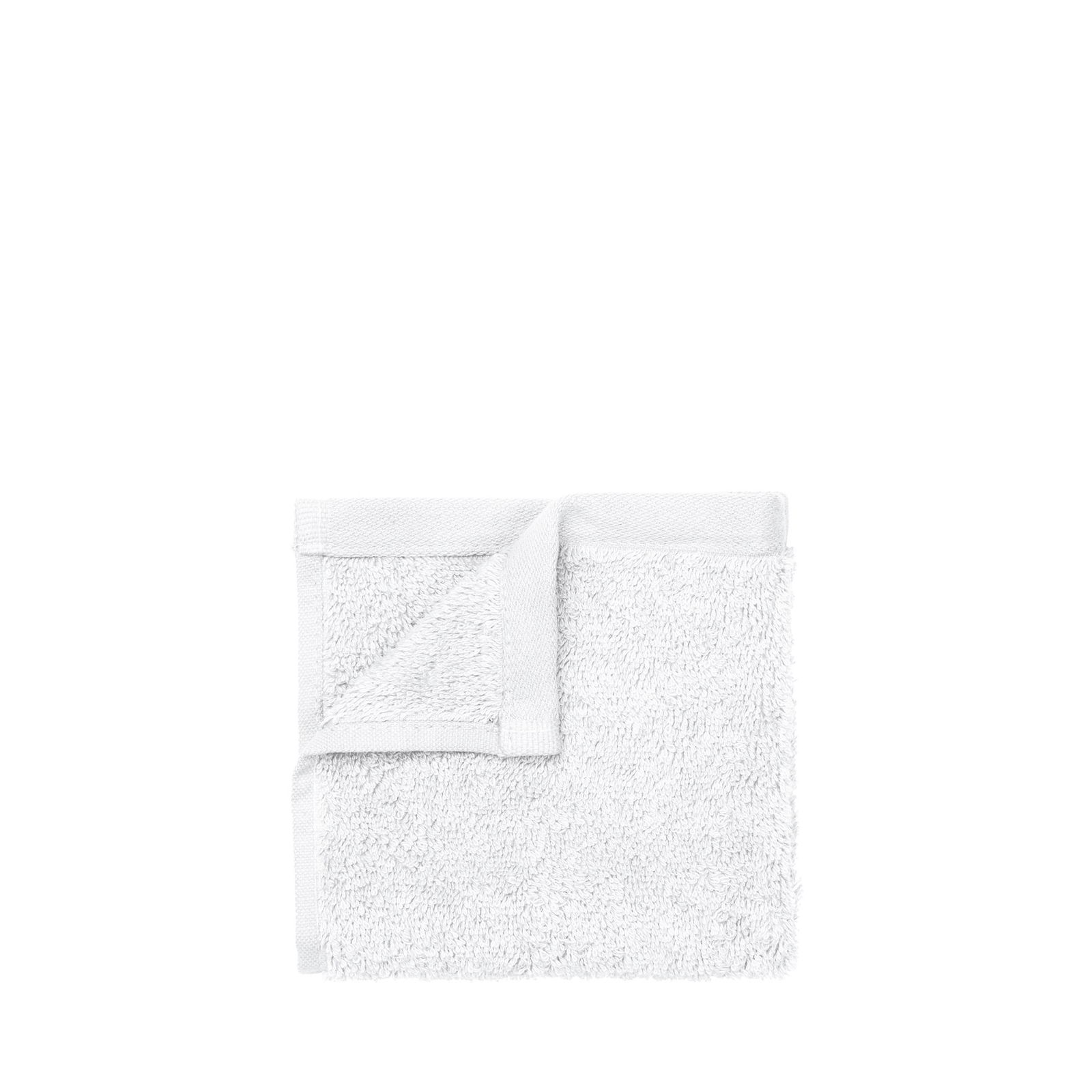 Soft white towel on a black background, perfect for home or spa use.