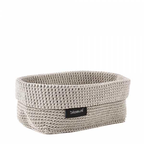 Stylish woven storage basket by Blomus in neutral color for organizing home spaces.