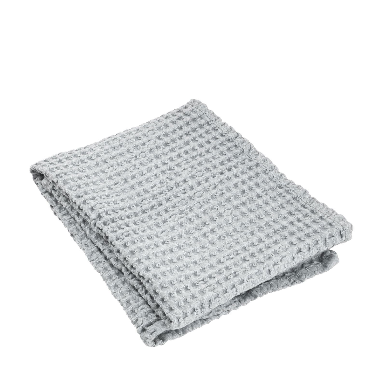 Gemütliche graue Waffel-Decke ordentlich gefaltet, perfekt für Wärme und Komfort in jeder Umgebung.