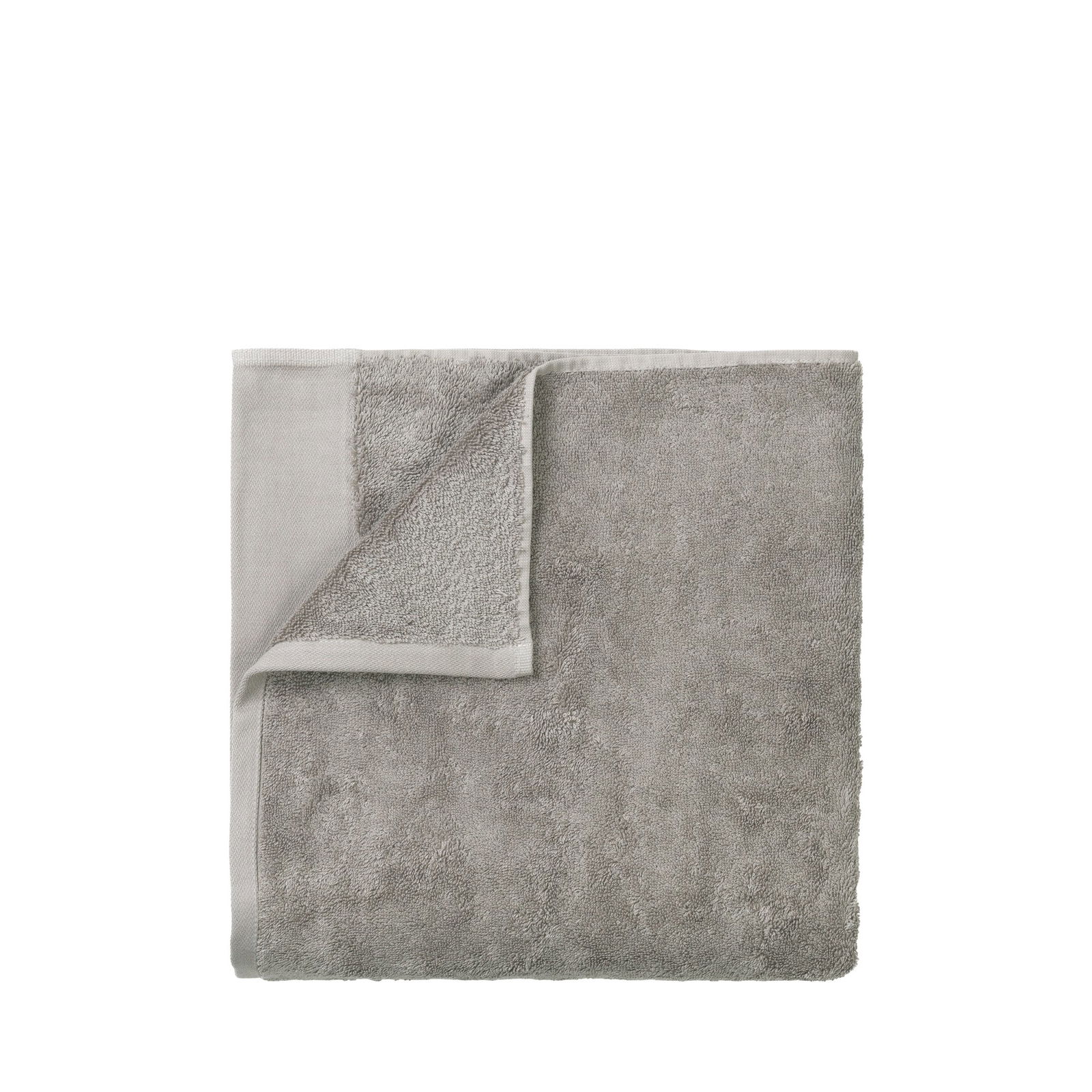 Weiches graues Handtuch mit strukturiertem Material, perfekt für das Badezimmer oder den Spa-Bereich.