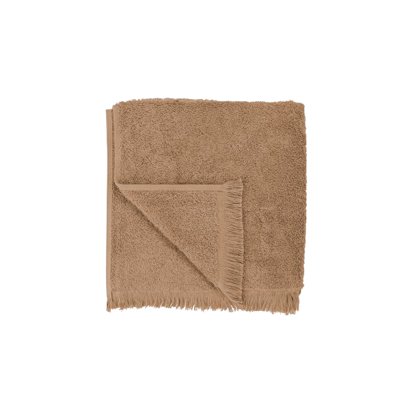 Soft brown linen napkin with frayed edges, perfect for elegant dining settings.