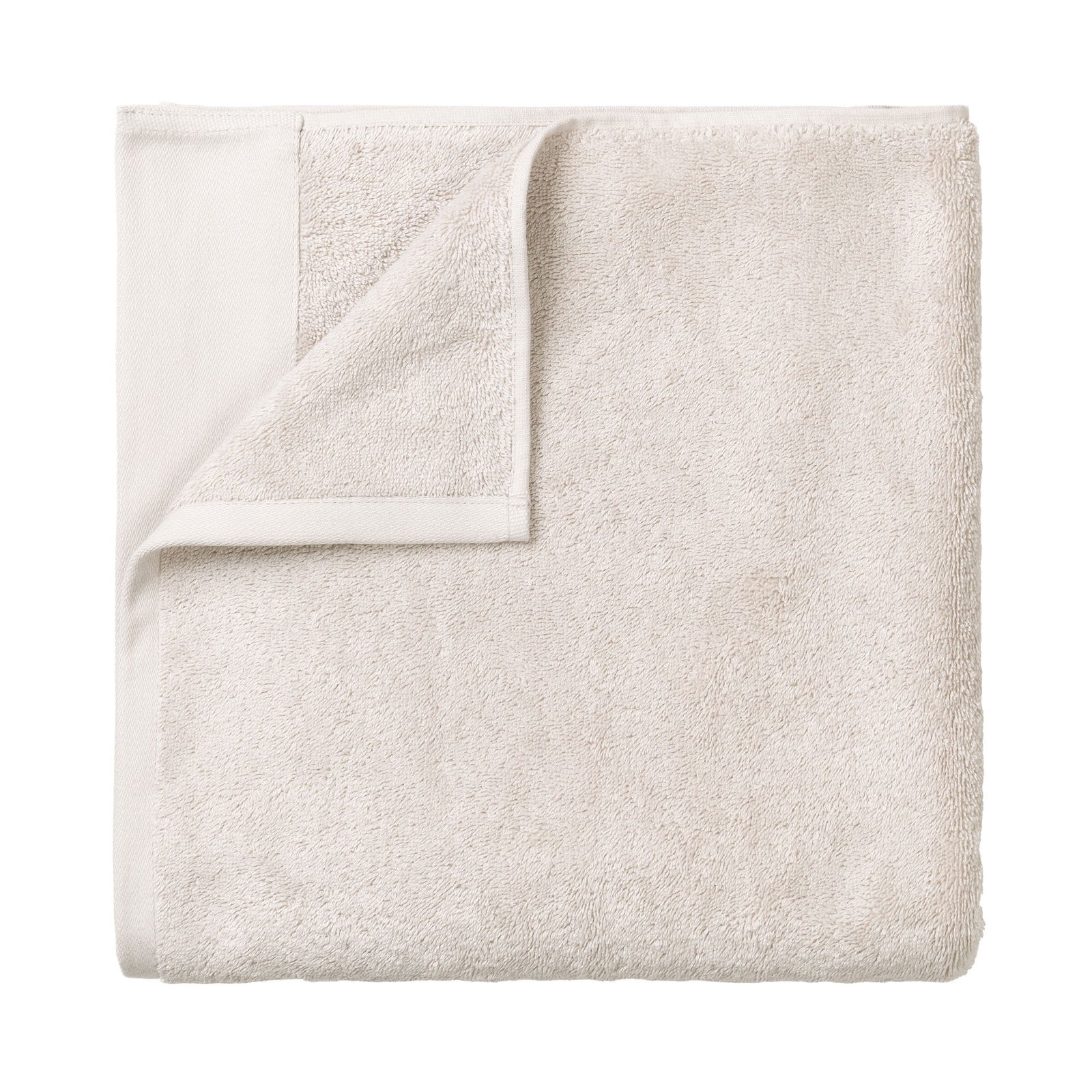 Soft beige towel folded neatly for home or spa use.