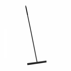 Black floor squeegee leaning against a white background.