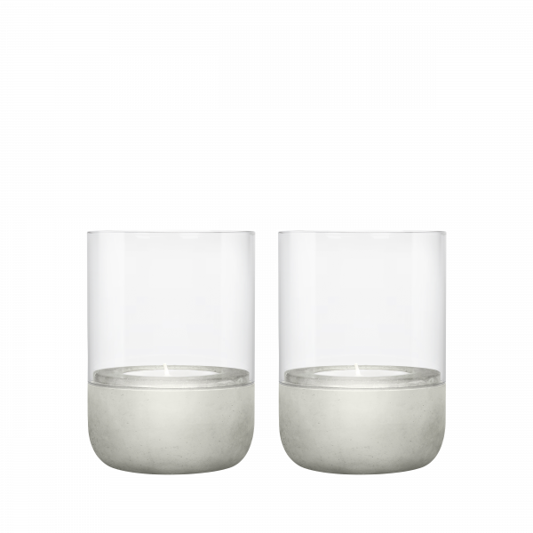 Set of two modern candle holders with clear glass and concrete bases.