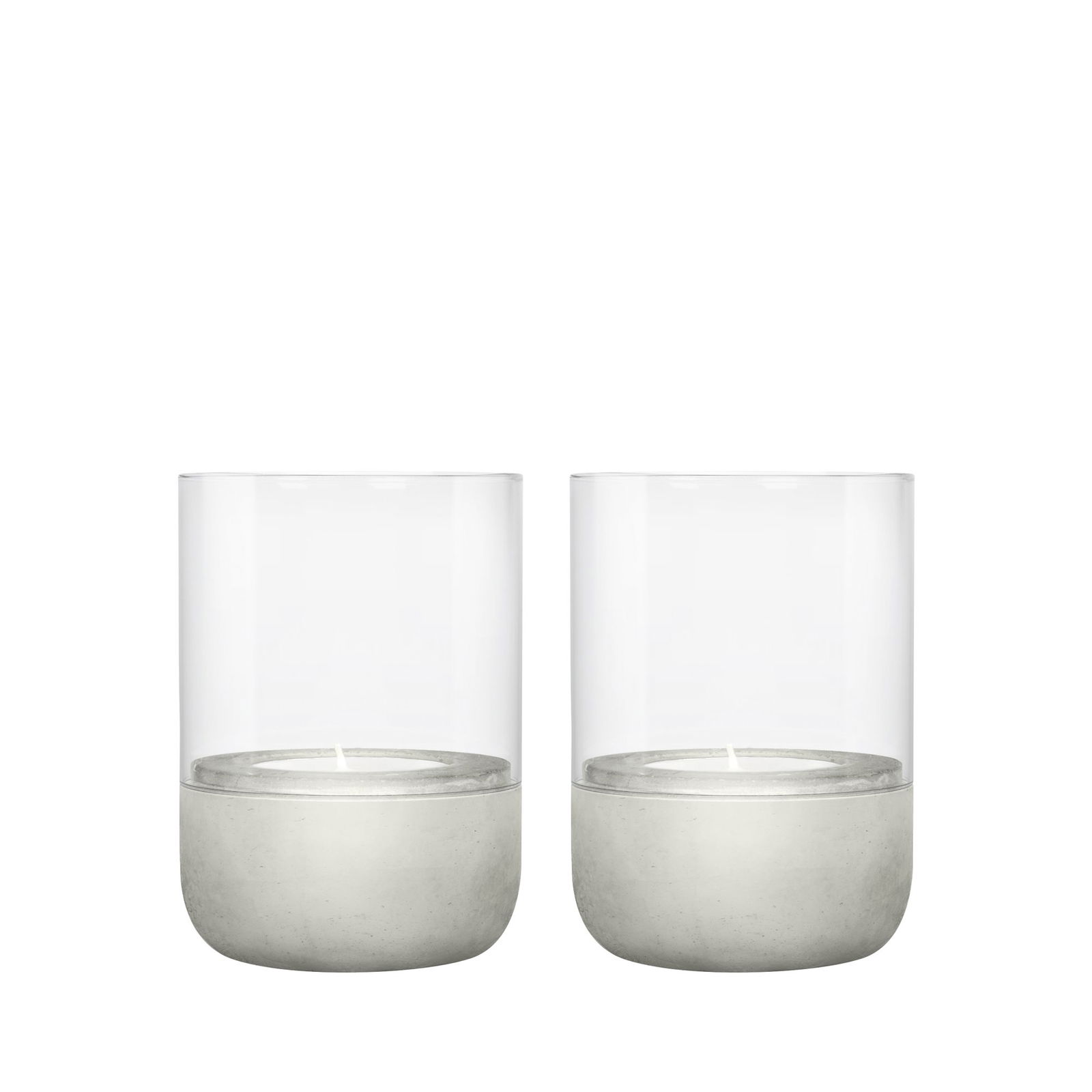 Set of two modern candle holders with clear glass and concrete bases.