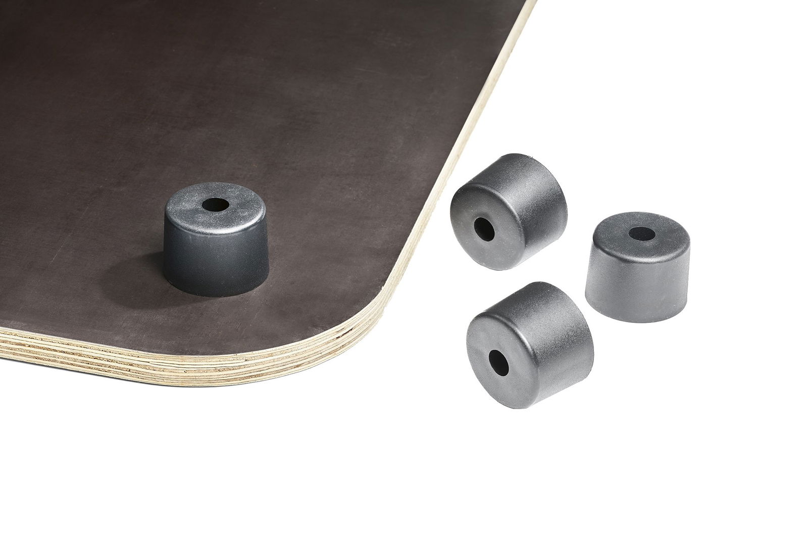 Rubber bumpers on a wooden surface, ideal for furniture protection and stability.