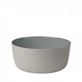Ceramic bowl with a matte gray exterior and glossy blue interior on a white background.