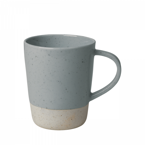 Blue speckled ceramic mug with a light beige base, perfect for coffee or tea.