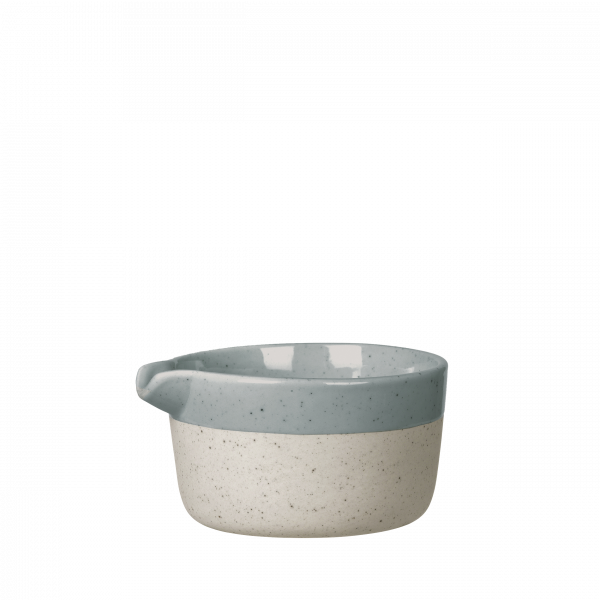 Small ceramic bowl with a speckled cream and blue design, perfect for serving sauces.