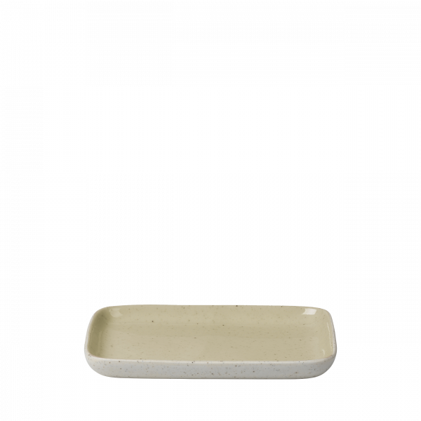 Minimalist ceramic serving platter with a speckled beige design on a white background.