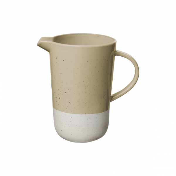 Beige ceramic pitcher with a speckled white bottom and a sleek handle.