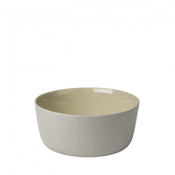 Helles graues Keramikschüssel mit einem glatten, glänzenden gelben Innenraum und gesprenkeltem Design.