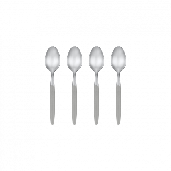 Four stainless steel spoons neatly arranged on a black background.