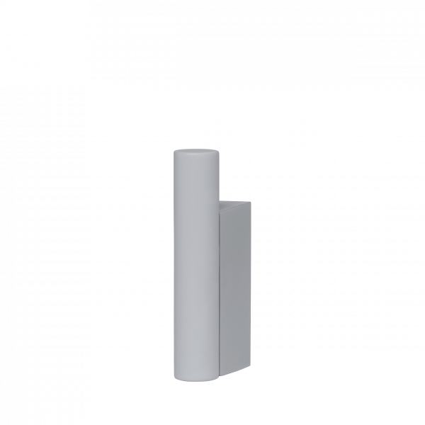Minimalist gray sculpture with cylindrical and rectangular shapes against a black background.