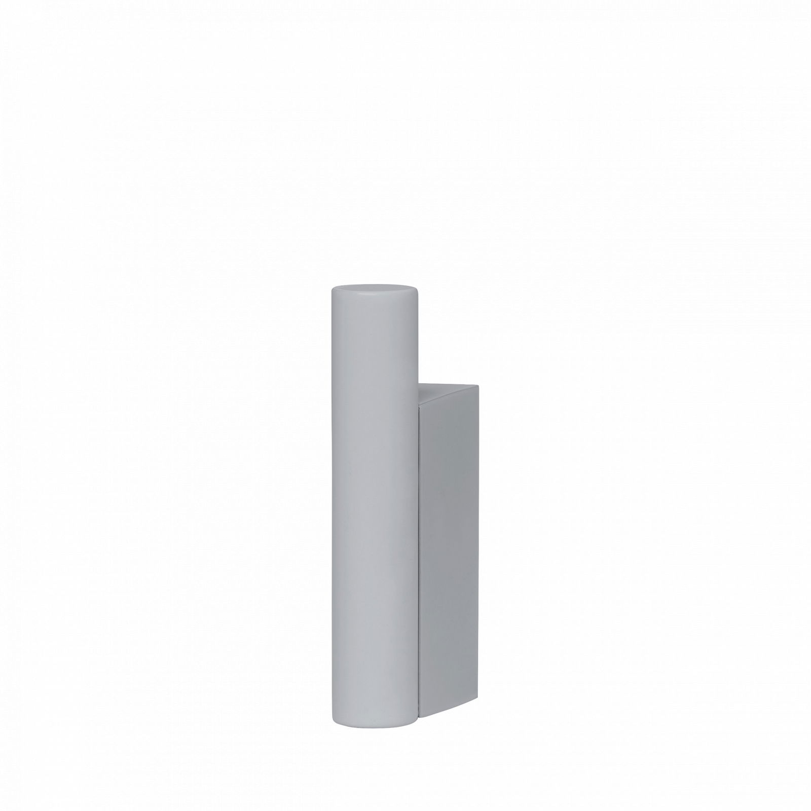 Minimalist gray sculpture with cylindrical and rectangular shapes against a black background.