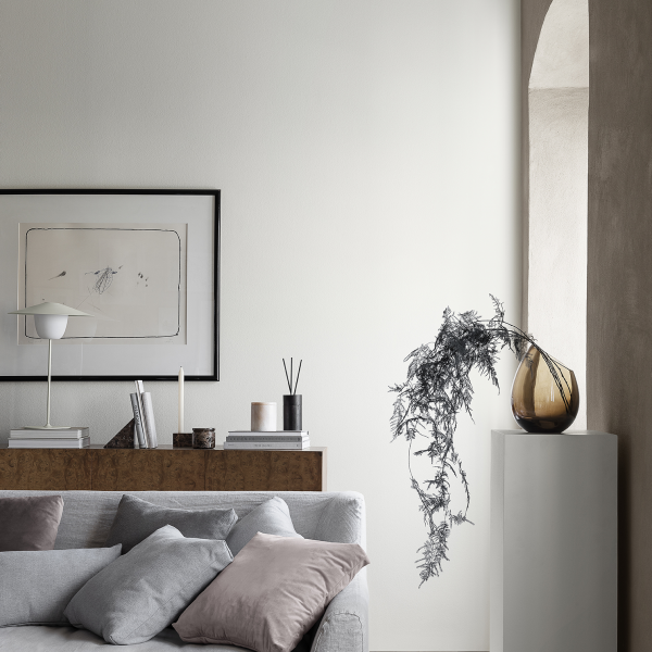 Modern living room interior featuring a minimalist design and elegant decor elements.