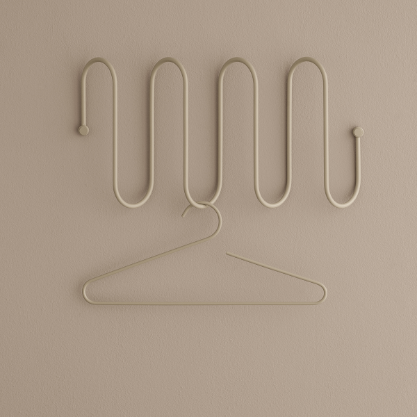 Stilvoller beiger Wandhaken mit geschwungenem Design und einem einzelnen Haken zur Wohnungsorganisation.