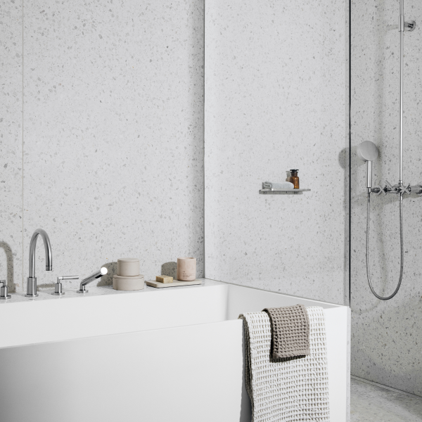 Modern bathroom design featuring a sleek tub and stylish shower area with minimalist decor.