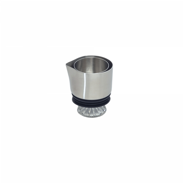 Stainless steel cocktail jigger with a clear rubber base for accurate pouring measurements.