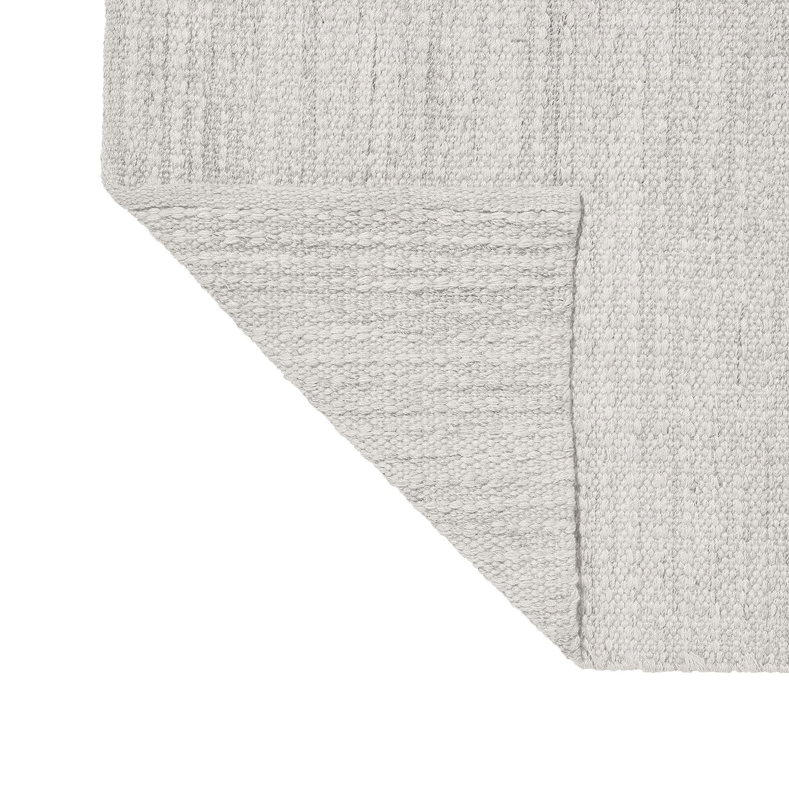 Soft gray woven rug corner with texture details and a clean edge.