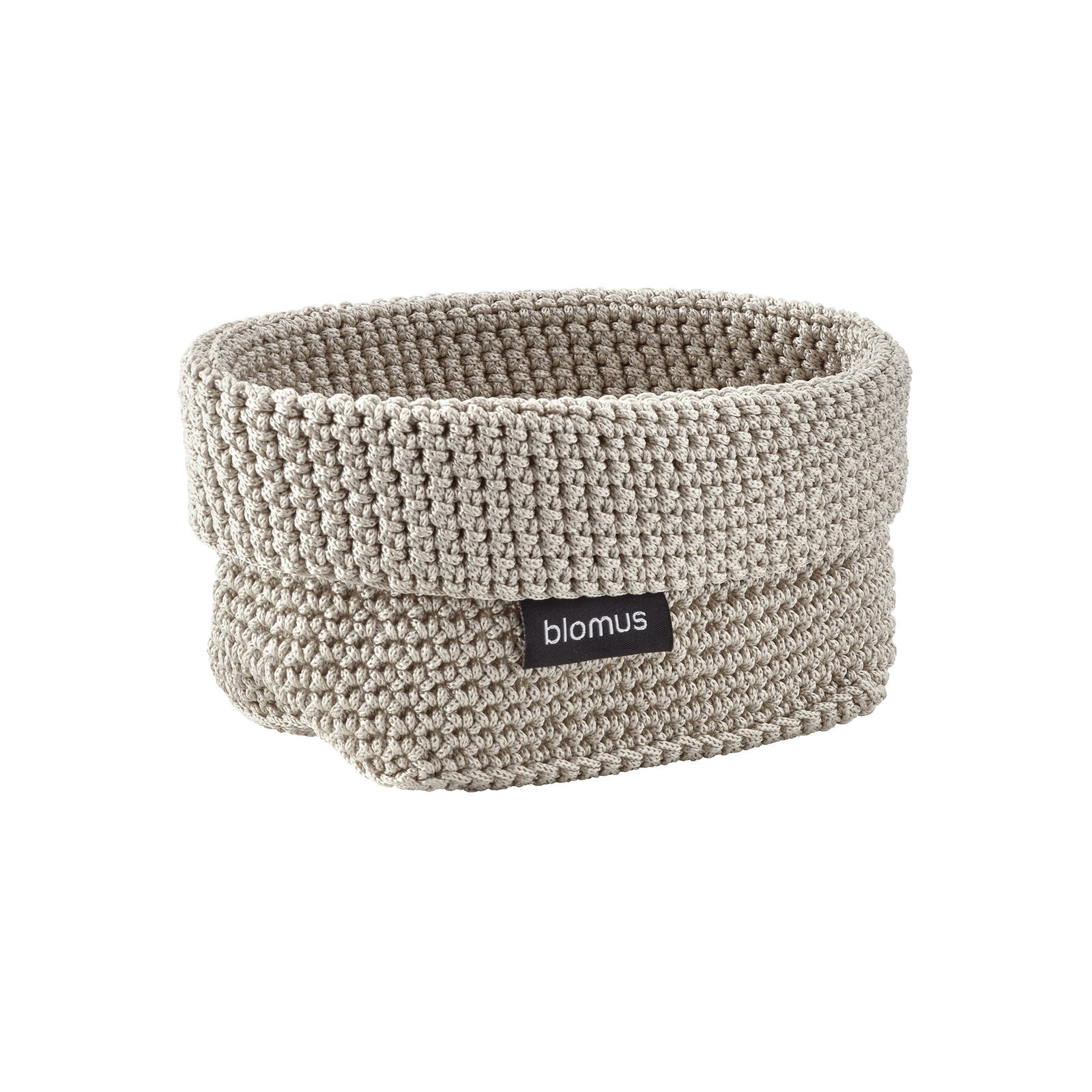 "Soft beige woven storage basket by Blomus, perfect for organizing any space."