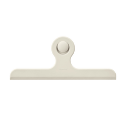Stylish modern clip with a circular button, perfect for organizing documents.