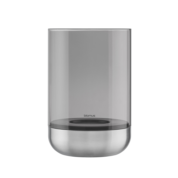 Sleek modern glass candle holder with a stainless steel base by Blomus.