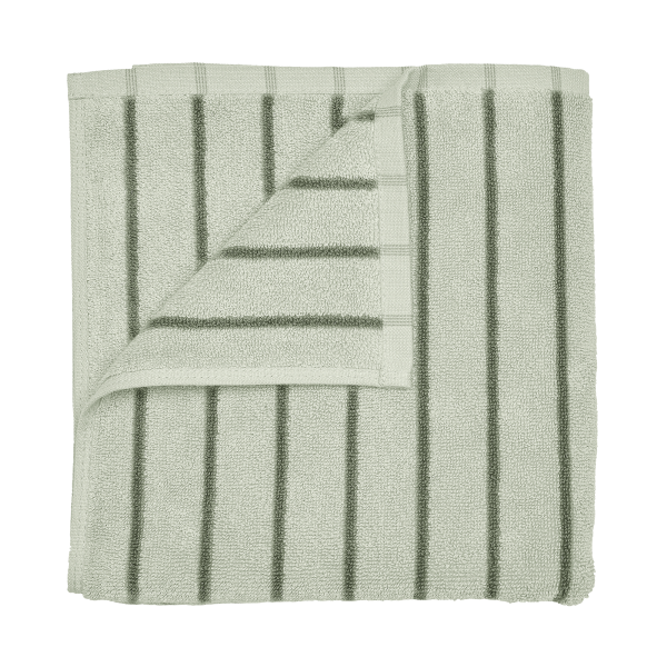 Soft green striped bathroom towel folded neatly for a fresh and elegant look.