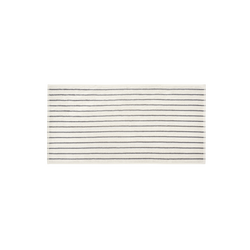 Striped cream and black area rug with a minimalist design for modern home decor.