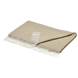 Cozy beige blanket with white fringes, perfect for home decor and warmth.