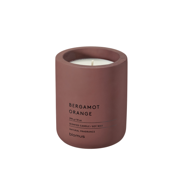 Bergamot orange scented candle in a minimalist terracotta holder for natural aroma.
