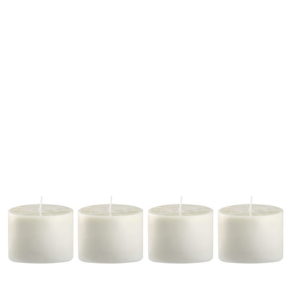 Four white candles in a row, perfect for home decor and soothing ambiance.